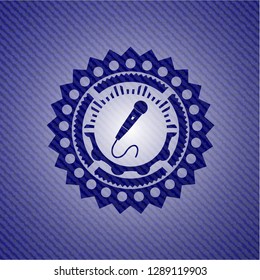 microphone icon inside emblem with jean high quality background