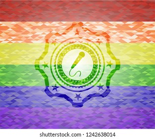 microphone icon inside emblem on mosaic background with the colors of the LGBT flag