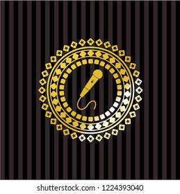 microphone icon inside gold badge