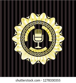 microphone icon inside gold shiny badge