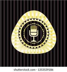 microphone icon inside golden emblem