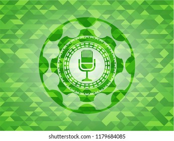 microphone icon inside green emblem. Mosaic background