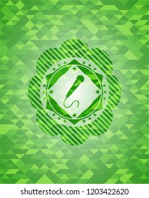 microphone icon inside green emblem with mosaic background