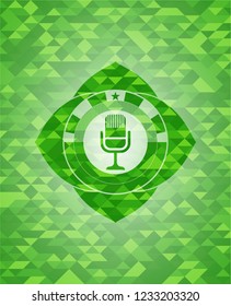microphone icon inside green emblem with mosaic background
