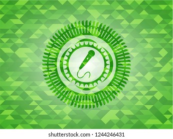 microphone icon inside green emblem with mosaic background