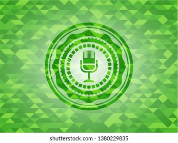 microphone icon inside green emblem with mosaic background