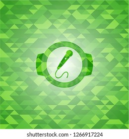 microphone icon inside green mosaic emblem