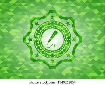 microphone icon inside green mosaic emblem