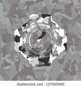 microphone icon inside grey camo texture