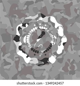 microphone icon inside grey camo emblem