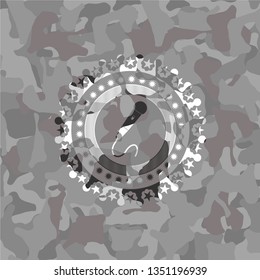 microphone icon inside grey camo emblem