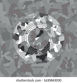microphone icon inside grey camo emblem