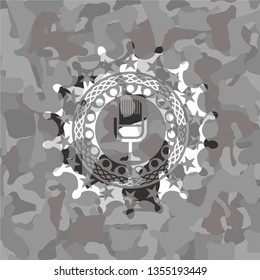 microphone icon inside grey camouflage texture
