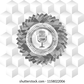 microphone icon inside grey emblem with geometric cube white background