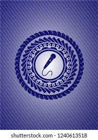 microphone icon inside jean background