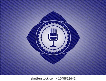 microphone icon inside jean or denim emblem or badge background