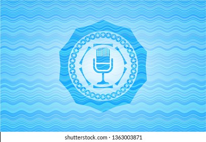 microphone icon inside light blue water emblem background.