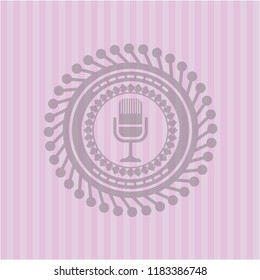microphone icon inside pink emblem