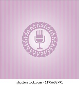 microphone icon inside pink emblem