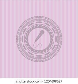 microphone icon inside pink emblem. Retro