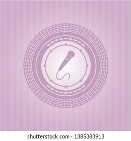 microphone icon inside pink emblem