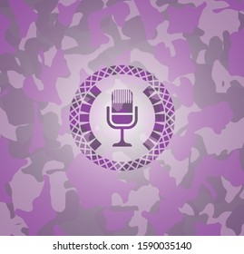microphone icon inside pink and purple camo emblem