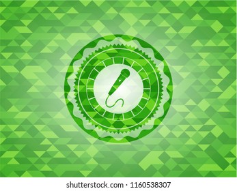 microphone icon inside realistic green mosaic emblem