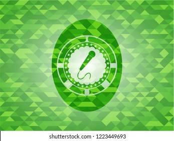 microphone icon inside realistic green mosaic emblem