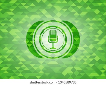 microphone icon inside realistic green mosaic emblem