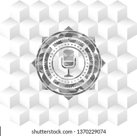 microphone icon inside realistic grey emblem with cube white background