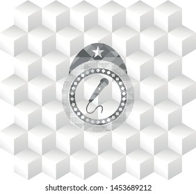 microphone icon inside realistic grey emblem with geometric cube white background