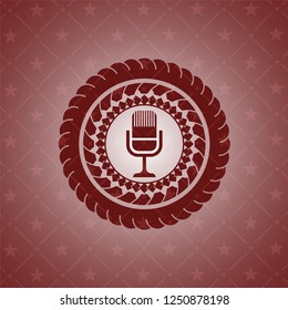 microphone icon inside realistic red emblem
