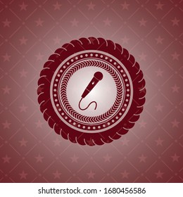 microphone icon inside realistic red emblem