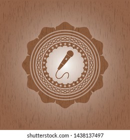 microphone icon inside realistic wooden emblem