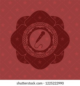 microphone icon inside red emblem