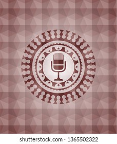 microphone icon inside red emblem or badge with abstract geometric pattern background. Seamless.