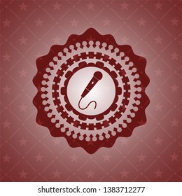 microphone icon inside red emblem