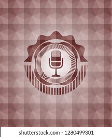 microphone icon inside red geometric pattern emblem. Seamless.