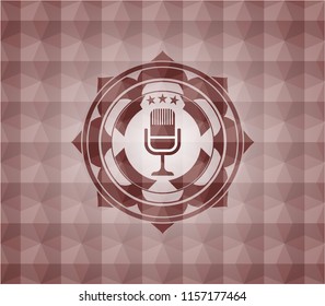 microphone icon inside red seamless polygonal badge.