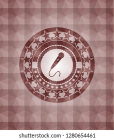 microphone icon inside red seamless badge with geometric pattern background.