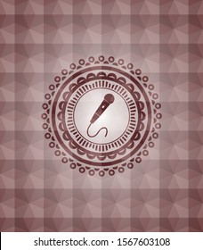 microphone icon inside red seamless geometric emblem.