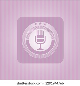microphone icon inside retro pink emblem