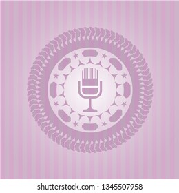 microphone icon inside retro pink emblem