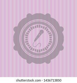 microphone icon inside retro pink emblem