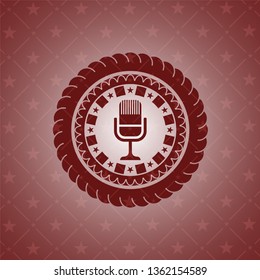 microphone icon inside retro red emblem