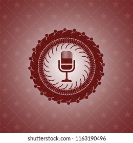 microphone icon inside retro style red emblem
