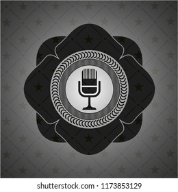 microphone icon inside retro style black emblem