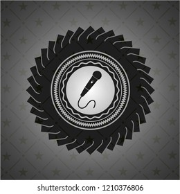 microphone icon inside retro style black emblem