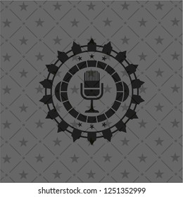 microphone icon inside retro style black emblem
