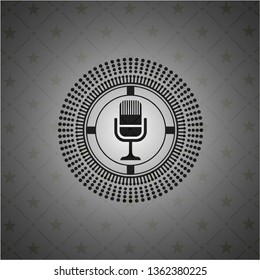 microphone icon inside retro style black emblem